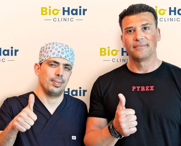 Dr Ibrahim with a patient after the DHI Hair Transplant